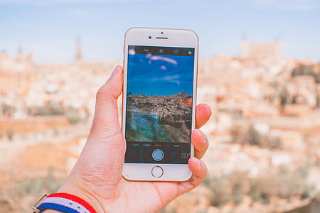 person holding gold iPhone 7 thumbnail