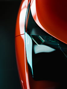 close up photo of red vehicle's headlight thumbnail