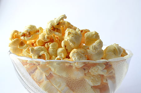 cheese coated popcorn on clear glass bowl thumbnail