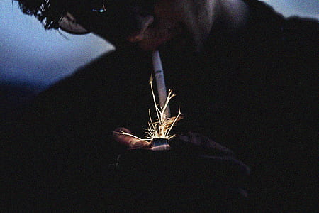 person lighting cigarette thumbnail