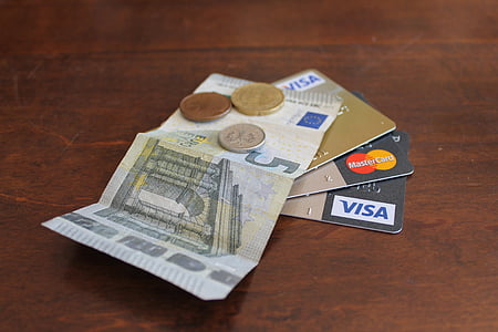 5 banknote on three assorted-color Visa cards thumbnail