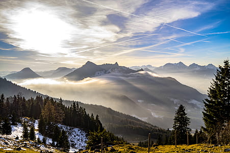 brown mountains under blue sky during daytime thumbnail