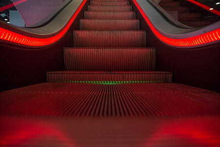 close photography of red lighted escalator thumbnail