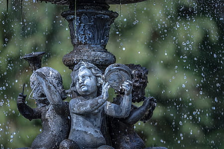 three children playing instrument base of water fountain thumbnail