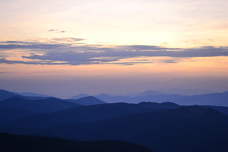 aerial silhouette photo of mountains during golden hour thumbnail