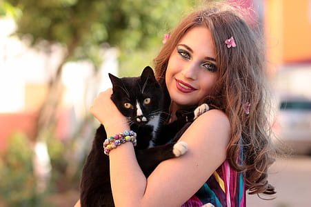 woman holding tuxedo cat thumbnail