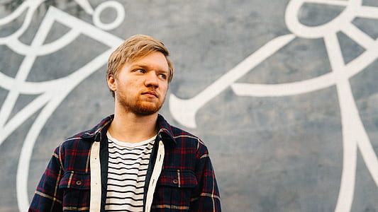 man wearing black and red plaid shirt thumbnail