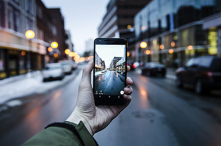 person holding opened black Android smartphone thumbnail