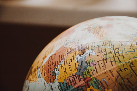 selective focus photography of multicolored desk globe thumbnail