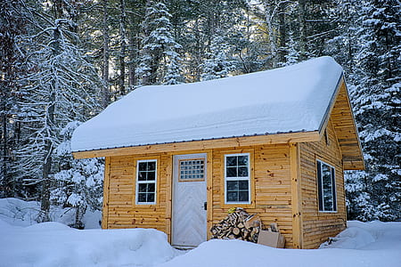 Snow Covered Wooden House Inside Forest thumbnail