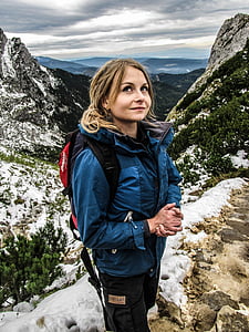 woman wearing blue and gray windbreaker jacket thumbnail