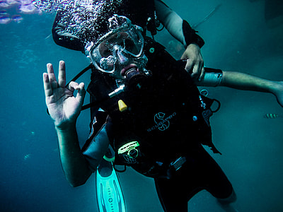 person wearing scuba suit under water thumbnail