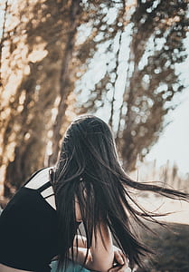 woman sitting outdoor during day thumbnail