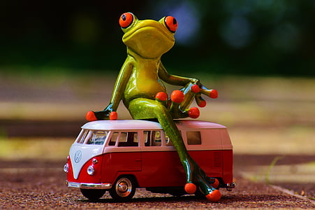 green frog toy sitting on a red Volkswagen T2 van toy thumbnail