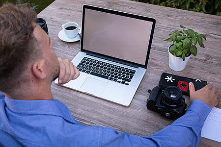 man using laptop on the table thumbnail