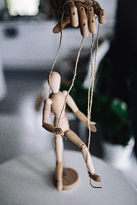 Wooden mannequin in various poses thumbnail