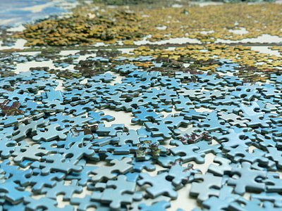 green and blue puzzle piece on floor thumbnail