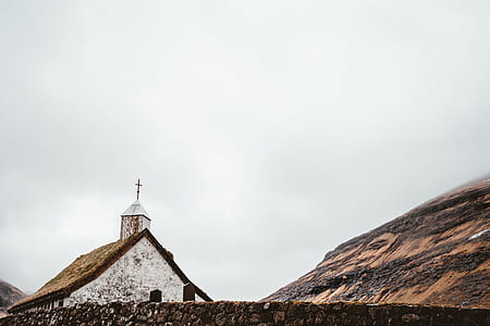 photo of white cathedral near mountain thumbnail
