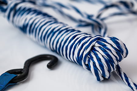 selective focus and closeup photography of blue and white stripe rope thumbnail