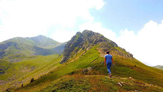 man hiking on mountain thumbnail