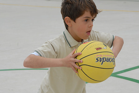 boy holding yellow basketball thumbnail