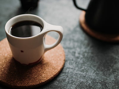 white ceramic mug on cork mat thumbnail