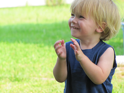 boy wearing black crew-neck sleeveless shirt about to clap his hands thumbnail