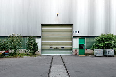 gray building with roller shuter thumbnail