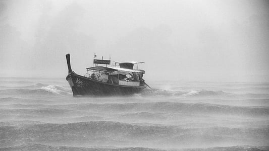 motorboat on wavy sea while raining thumbnail