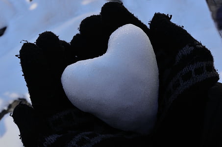 heart snow on person's palms thumbnail