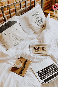 Morning coffee in bed. Working in bed thumbnail