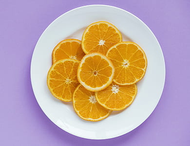six sliced lemons on round white ceramic plate thumbnail