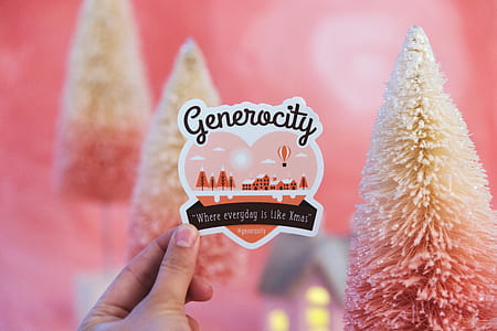 person holding heart with generocity-printed card thumbnail