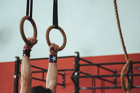 gymnast lifting himself on ring bar thumbnail