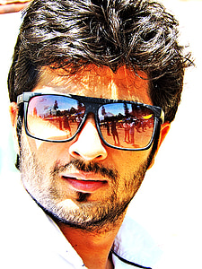 man wearing black framed sunglasses in close-up photography thumbnail