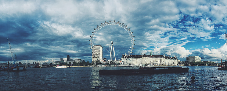 white ferris wheel near body of water thumbnail