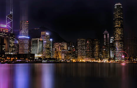 landscape photo of city buildings during night thumbnail
