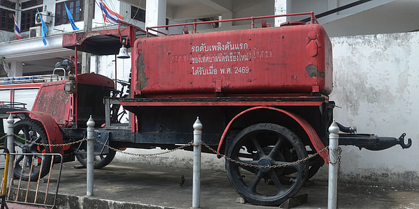 vintage red firetruck parked thumbnail