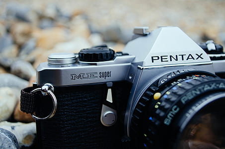 selected focus photo fo gray and black Pentax bridge camera thumbnail