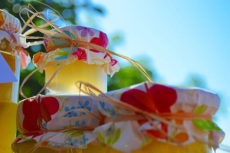 closeup photo of clear glass jars under blue sky during daytime thumbnail