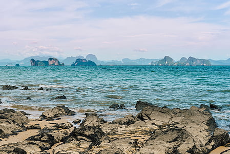 photography of sea near rock formation at daytime thumbnail