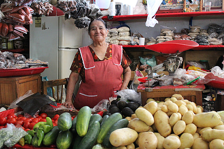 woman wearing red dress standing in top of vegetables thumbnail