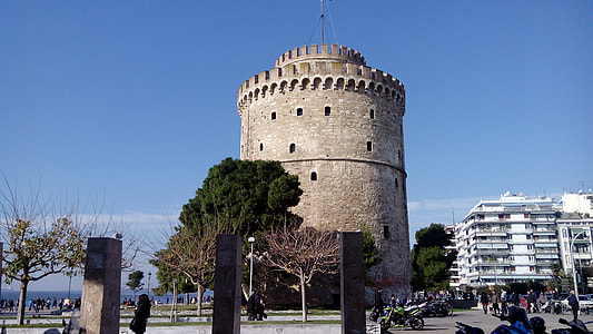 gray concrete tower surrounded by trees thumbnail