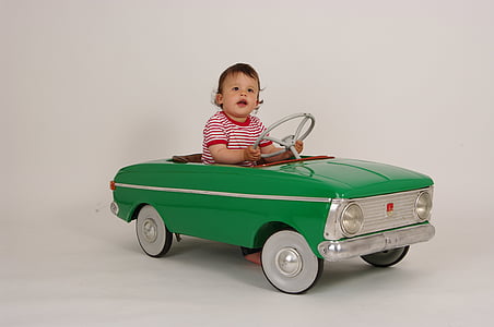 baby riding green ride-on toy car thumbnail