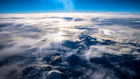 white and blue sky above mountain thumbnail