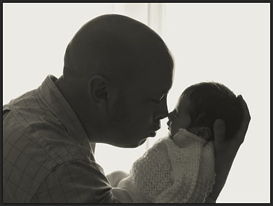 man carrying baby thumbnail