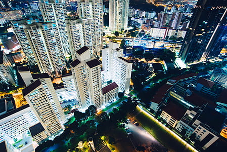 aerial view photography of city buildings during night time thumbnail