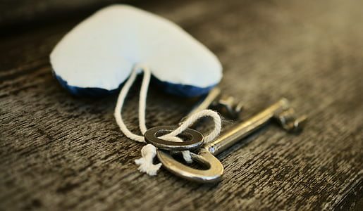 two silver-colored keys thumbnail