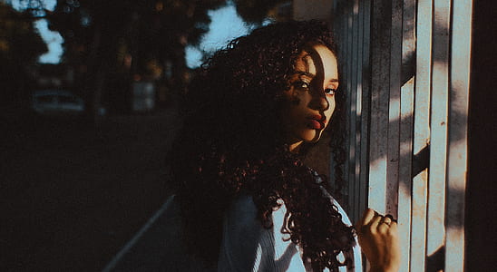 woman holding the fence with beam of lights thumbnail