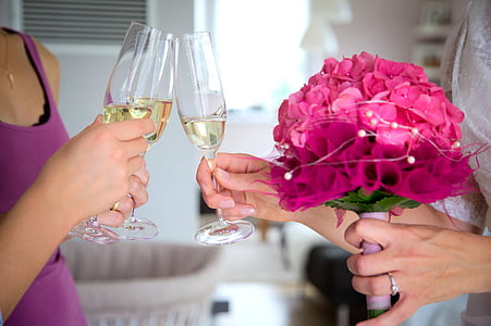 women holding champagne glass thumbnail